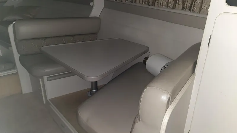 Slide: The Image of Interior of 1995 Carver 528 Montego with seating area and table. - 14