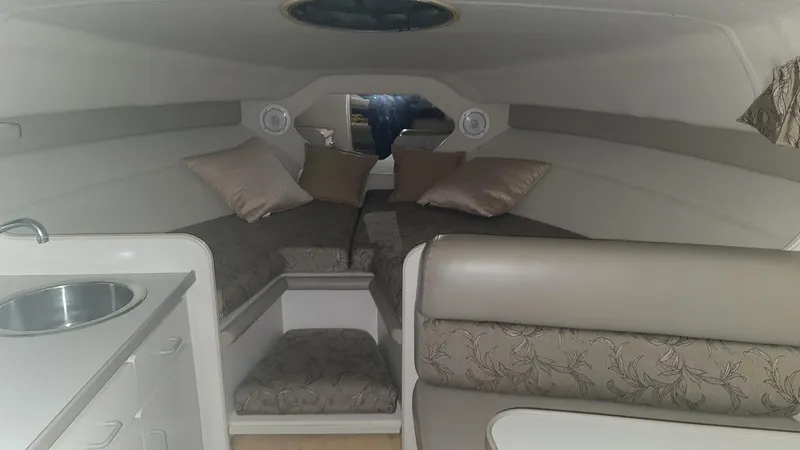 Slide: The Image of Interior of a 1995 Carver 528 Montego yacht with sleeping area. - 15