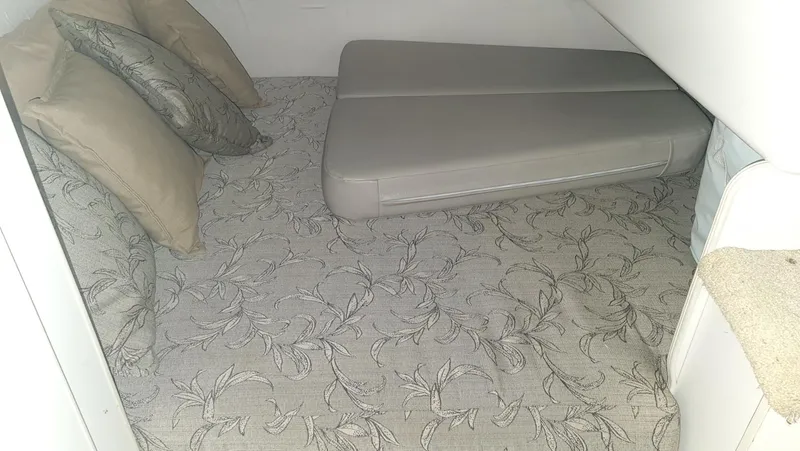 Slide: The Image of Interior of a 1995 Carver 528 Montego yacht with bed and pillows. - 19