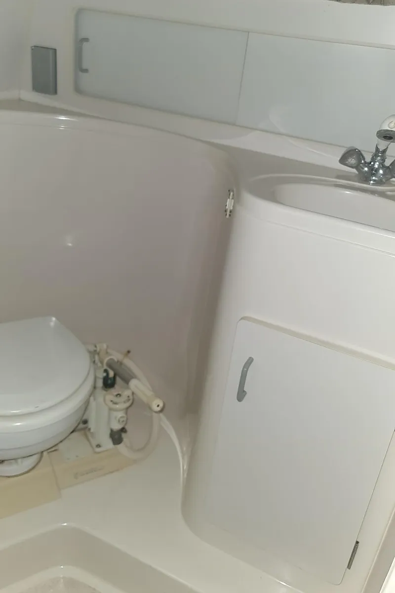 Slide: The Image of Bathroom in Carver 528 Montego boat, year 1995. - 26