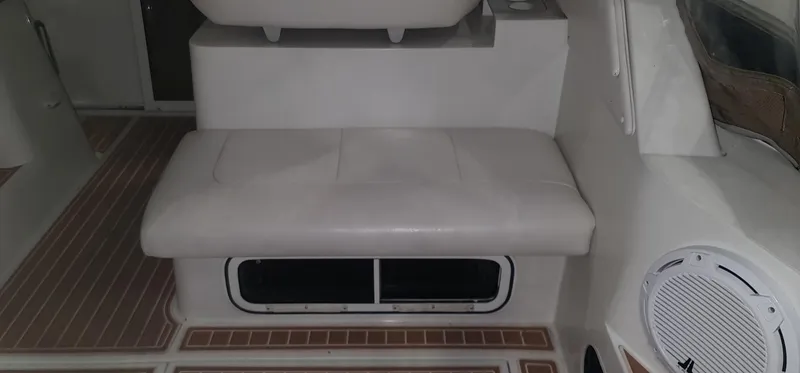 Slide: The Image of Interior of a 1995 Carver 528 Montego boat with seating area. - 5