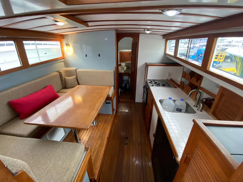 Slide: The Image of Interior of 1981 Rough Water 37 Sedan with dining area and kitchen. - 15