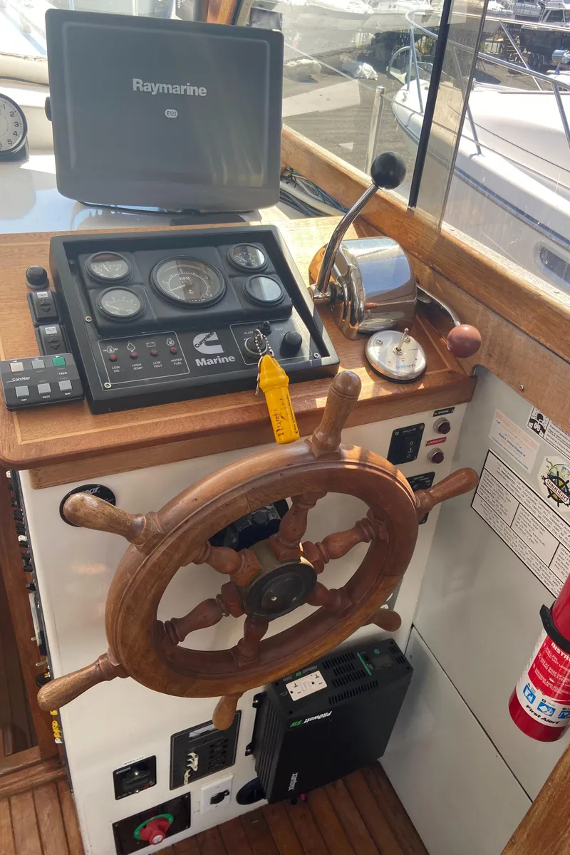 Slide: The Image of 1981 Rough Water 37 Sedan boat helm with Raymarine navigation system. - 20