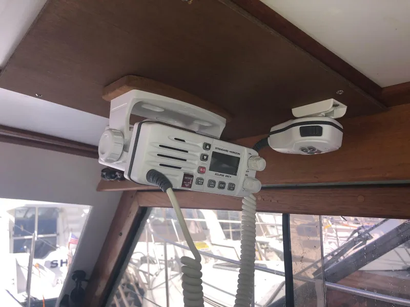Slide: The Image of Marine radio equipment inside a 1981 Rough Water 37 Sedan boat cabin. - 22