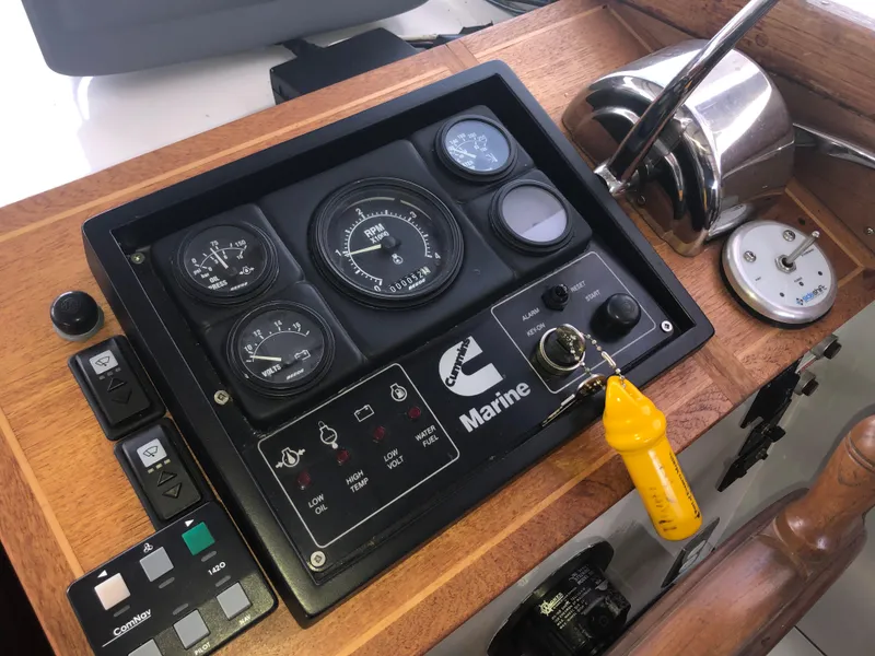 Slide: The Image of Control panel of a 1981 Rough Water 37 Sedan boat with gauges and switches. - 24