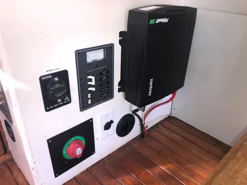 Slide: The Image of Electrical panel and inverter setup on 1981 Rough Water 37 Sedan boat. - 26