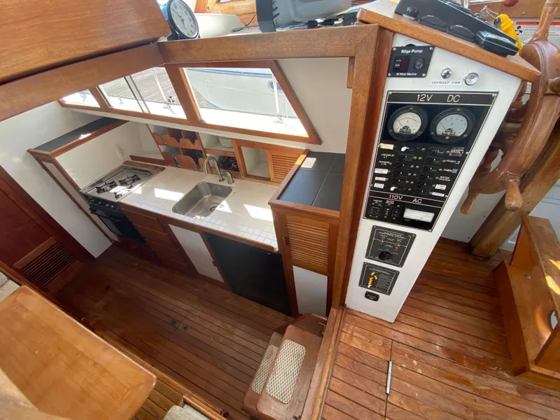 Slide: The Image of 1981 Rough Water 37 Sedan yacht interior with kitchen and control panel. - 30