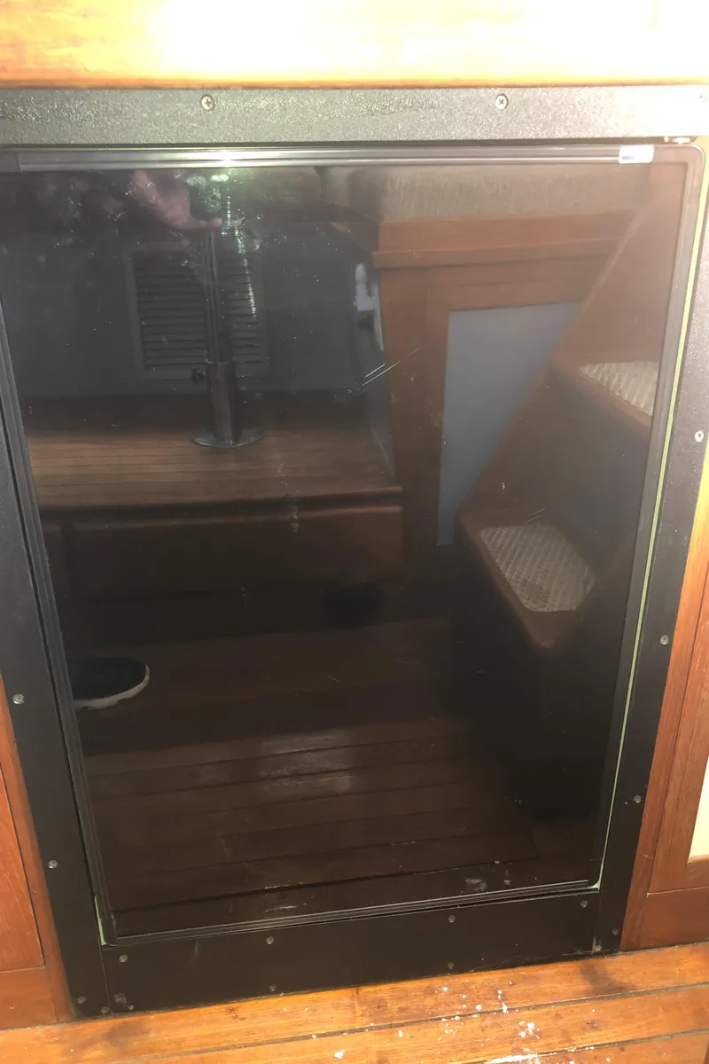 Slide: The Image of 1981 Rough Water 37 Sedan interior with wooden flooring and steps. - 34