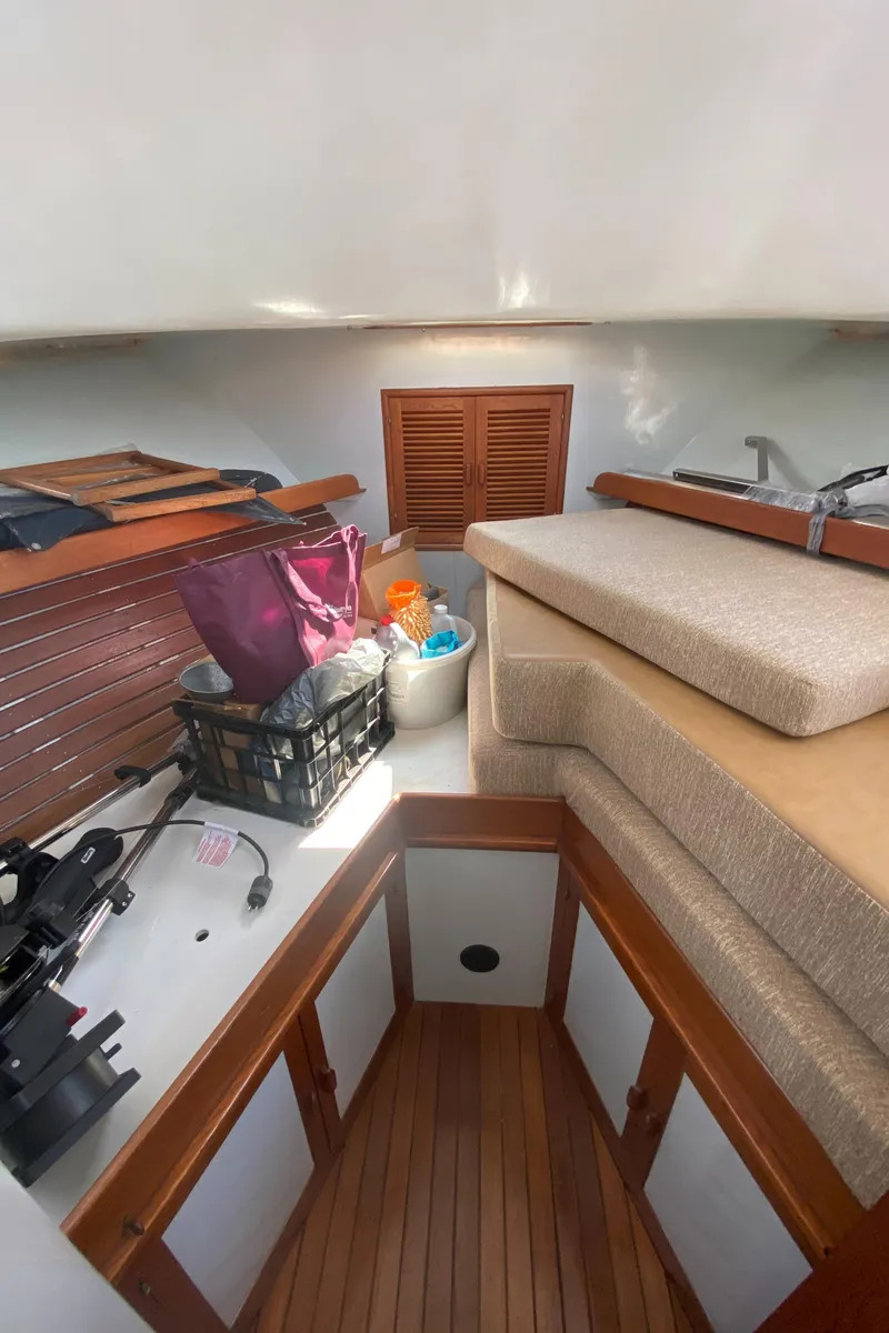 Slide: The Image of Interior of 1981 Rough Water 37 Sedan boat with storage and seating area. - 39