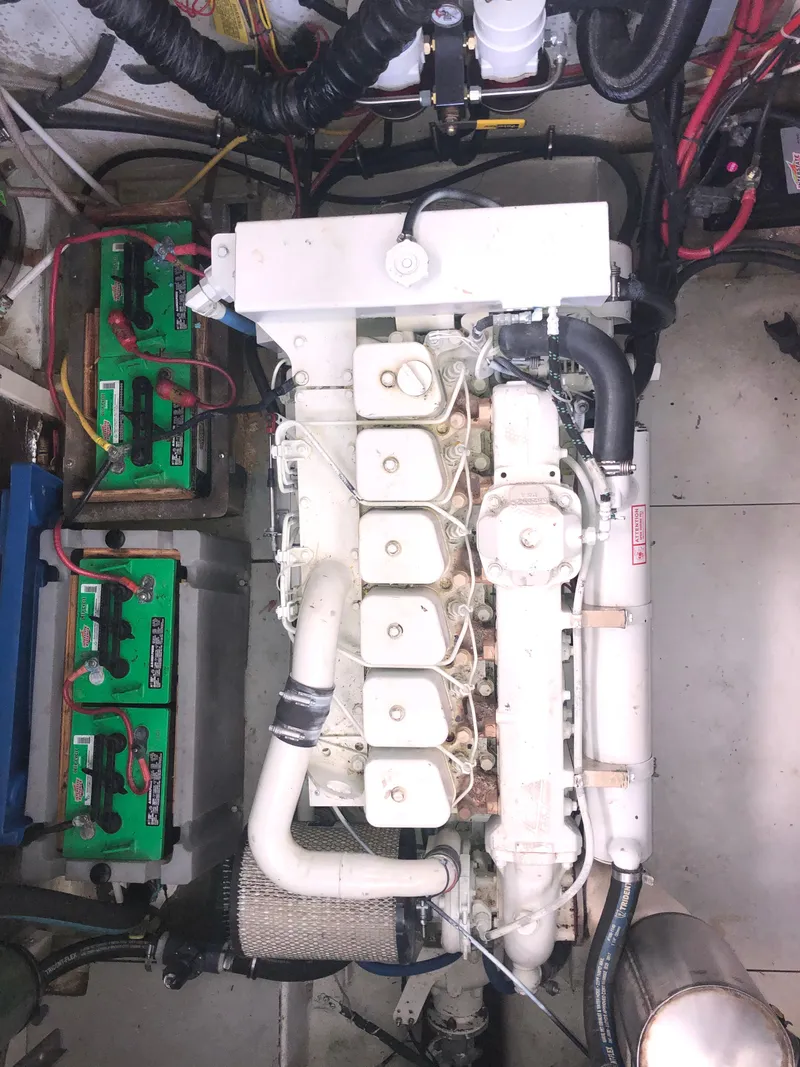 Slide: The Image of Engine compartment of 1981 Rough Water 37 Sedan with visible batteries and wiring. - 40