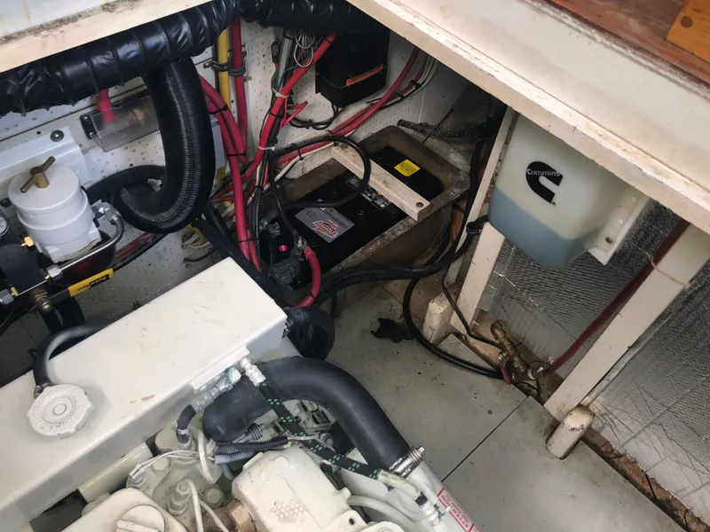 Slide: The Image of Engine compartment of a 1981 Rough Water 37 Sedan boat, showing wiring and components. - 42