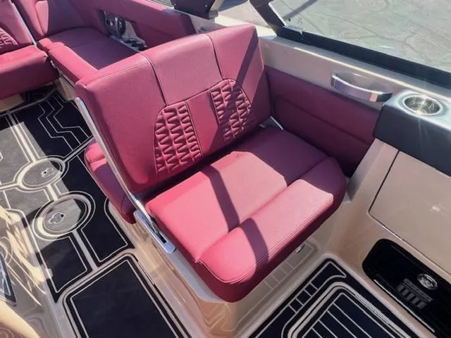 Slide: The Image of 2022 MasterCraft X26 interior with red seating and stylish black flooring. - 14