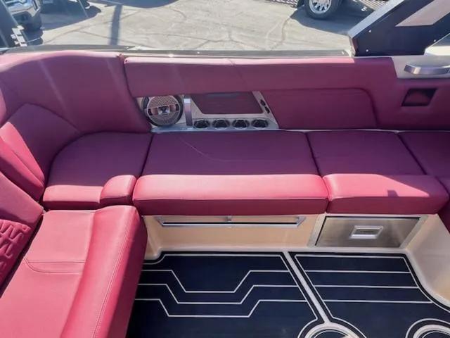 Slide: The Image of 2022 MasterCraft X26 interior with red seating and modern design elements. - 15