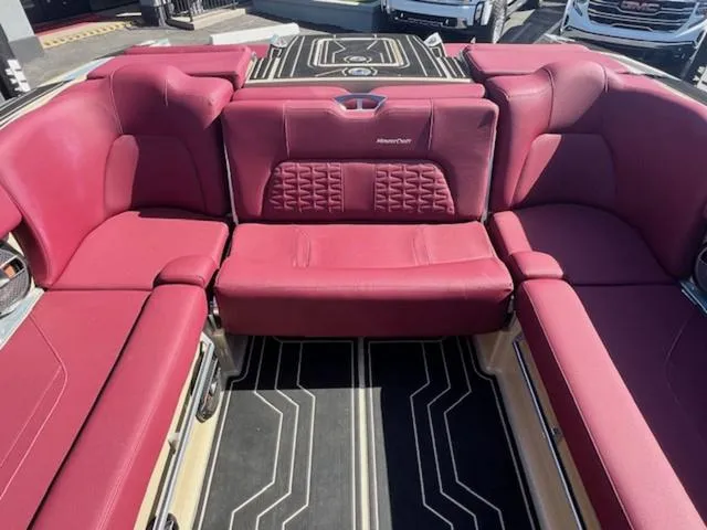 Slide: The Image of 2022 MasterCraft X26 boat interior with luxurious red seating. - 16