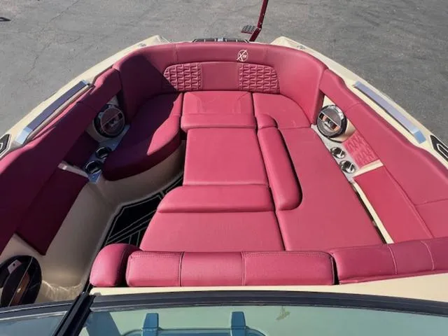 Slide: The Image of 2022 MasterCraft X26 boat with luxurious red seating and modern design. - 18