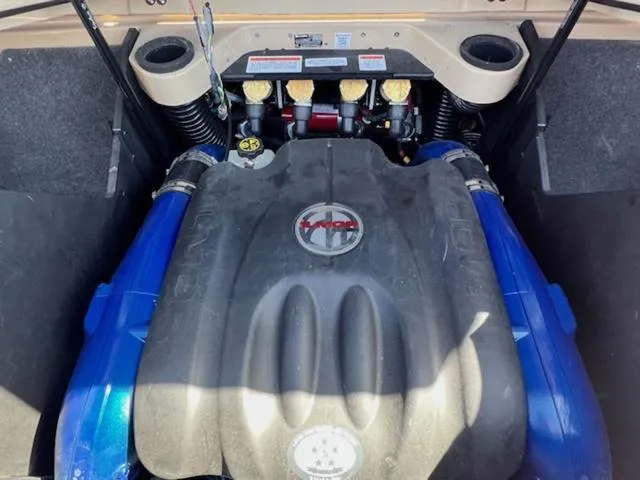 Slide: The Image of 2022 MasterCraft X26 engine compartment with blue accents and detailed components. - 22