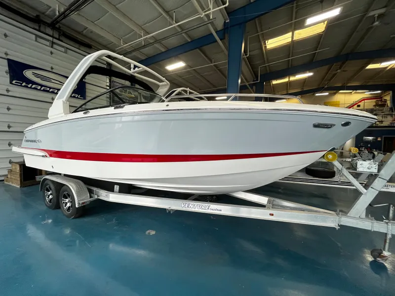 The Image of 2023 Chaparral 270 OSX boat on trailer in showroom. - 0