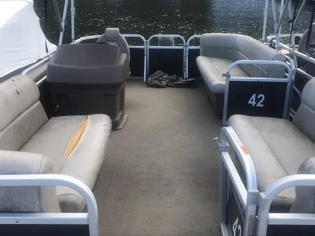 Slide: The Image of 2018 Princecraft Pontoon boat interior with spacious seating and open deck. - 3