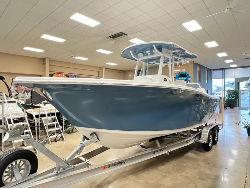 Slide: The Image of 2023 Sea Pro 259 Deep V CC boat on trailer in showroom. - 0