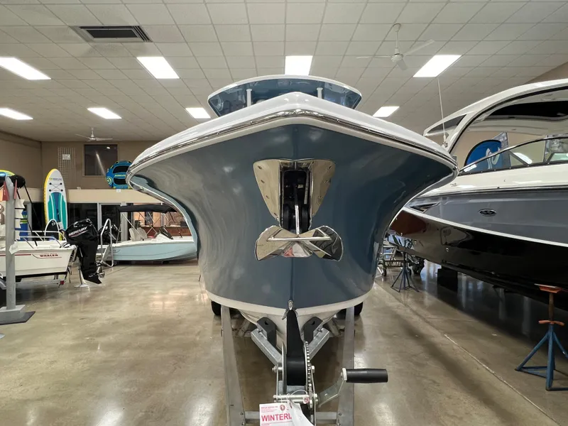 Slide: The Image of 2023 Sea Pro 259 Deep V CC boat displayed in showroom. - 3