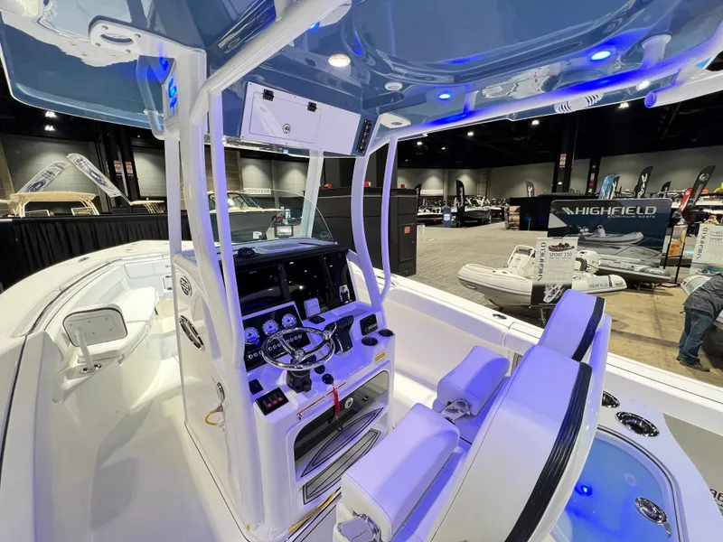 Slide: The Image of 2023 Sea Pro 259 Deep V CC boat interior with dual seats and control console. - 6