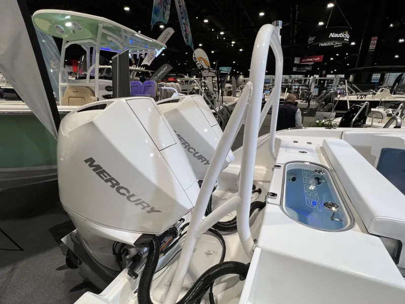 Slide: The Image of 2023 Sea Pro 259 Deep V CC with dual Mercury outboard engines at a boat show. - 7