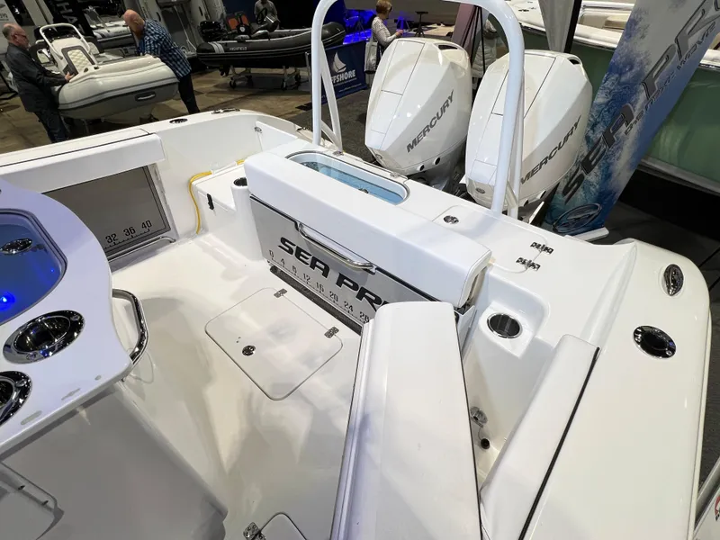 Slide: The Image of 2023 Sea Pro 259 Deep V CC boat interior with dual Mercury engines. - 8