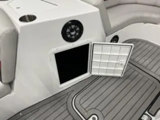 Slide: The Image of 2023 Hurricane SS188 boat interior with open storage compartment and speaker. - 16