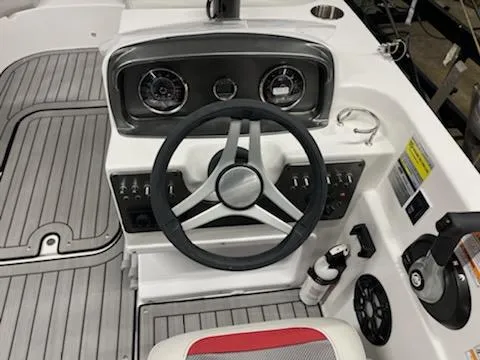 Slide: The Image of 2023 Hurricane SS188 boat dashboard with steering wheel and controls. - 4