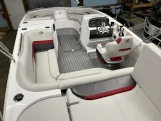 Slide: The Image of 2023 Hurricane SS188 boat interior with white and red seating, modern dashboard, and steering wheel. - 7