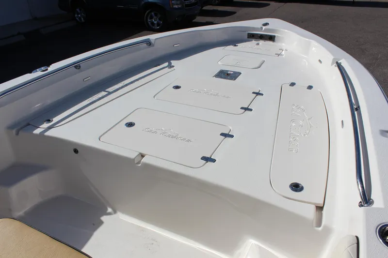 Slide: The Image of 2023 Sea Chaser 26 LX boat deck with storage compartments. - 6