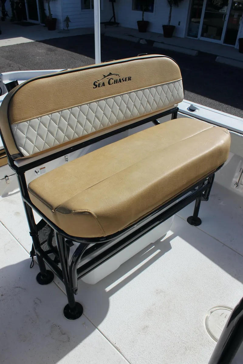 Slide: The Image of 2023 Sea Chaser 26 LX boat seat with beige upholstery and diamond stitching. - 9