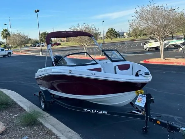 Slide: The Image of 2023 Tahoe 185 S boat with trailer in parking lot. - 1