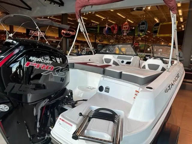 Slide: The Image of 2023 Tahoe 185 S boat with Mercury Pro XS engine displayed in showroom. - 3