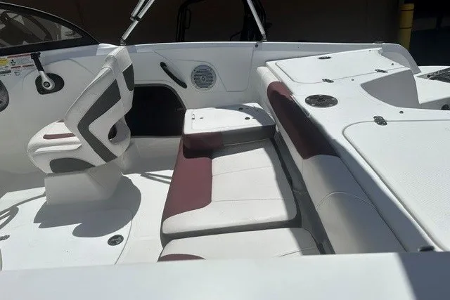 Slide: The Image of 2023 Tahoe 185 S boat interior with white and maroon seating, modern design. - 14