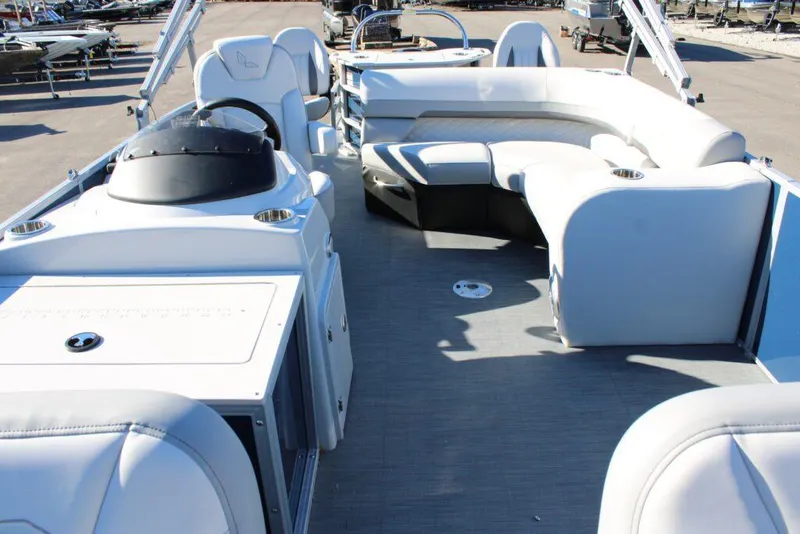 Slide: The Image of 2023 Lowe SF214 Sport Fish pontoon boat interior with seating and helm station. - 10