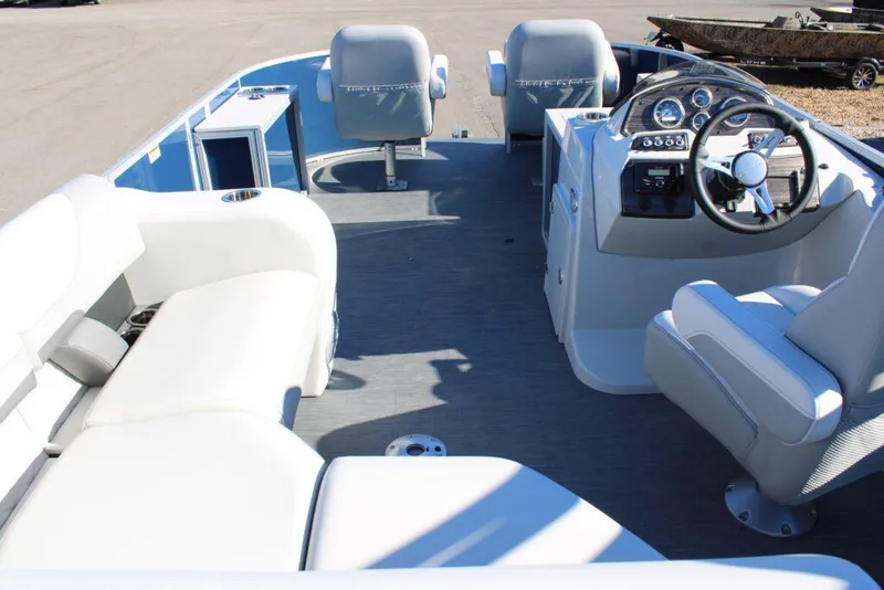 Slide: The Image of 2023 Lowe SF214 Sport Fish boat interior with seating and steering console. - 4