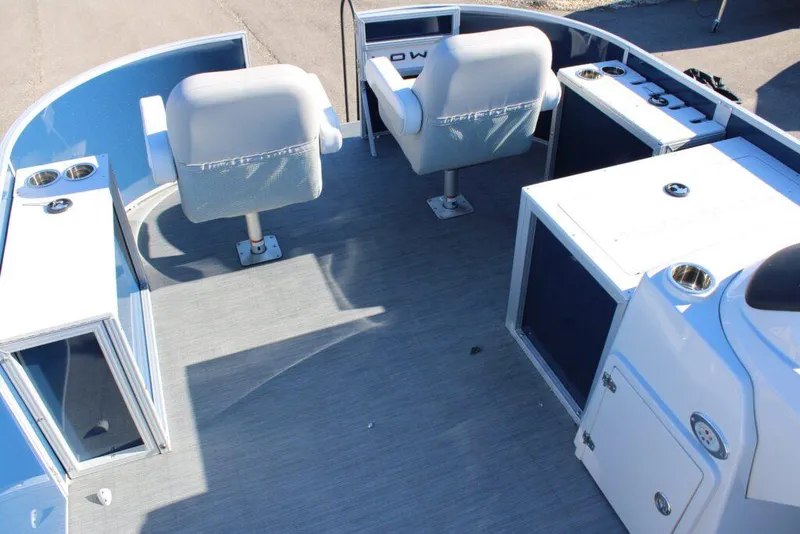 Slide: The Image of 2023 Lowe SF214 Sport Fish boat interior with seating and storage compartments. - 7