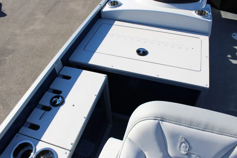 Slide: The Image of 2023 Lowe SF214 Sport Fish boat interior with storage compartments and seating. - 9