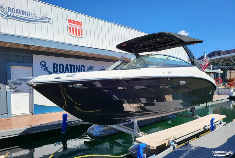 Slide: The Image of 2024 Sea Ray SLX 260 Surf boat displayed at Boating Lake Mead. - 1