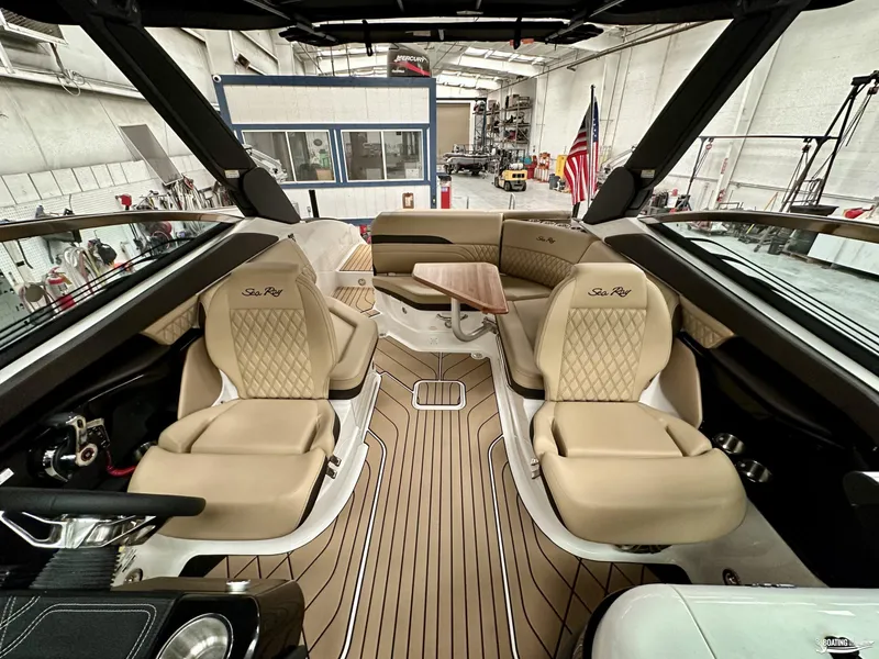 Slide: The Image of Luxurious interior of 2024 Sea Ray SLX 260 Surf boat with elegant seating and wood accents. - 10