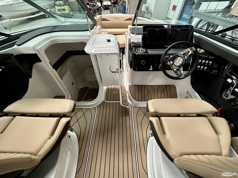 Slide: The Image of 2024 Sea Ray SLX 260 Surf boat interior with modern dashboard and seating. - 13