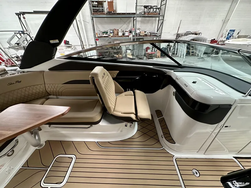 Slide: The Image of 2024 Sea Ray SLX 260 Surf boat interior with luxurious seating and sleek design. - 9