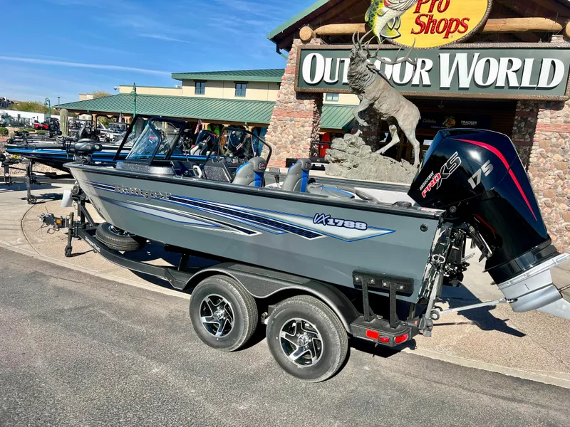 Slide: The Image of 2023 Ranger VX1788 WT fishing boat displayed outside Outdoor World. - 2