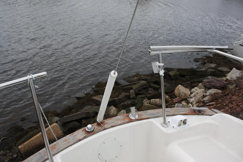 Slide: The Image of Pearson 323 sailboat deck near rocky shoreline, 1979 model. - 13