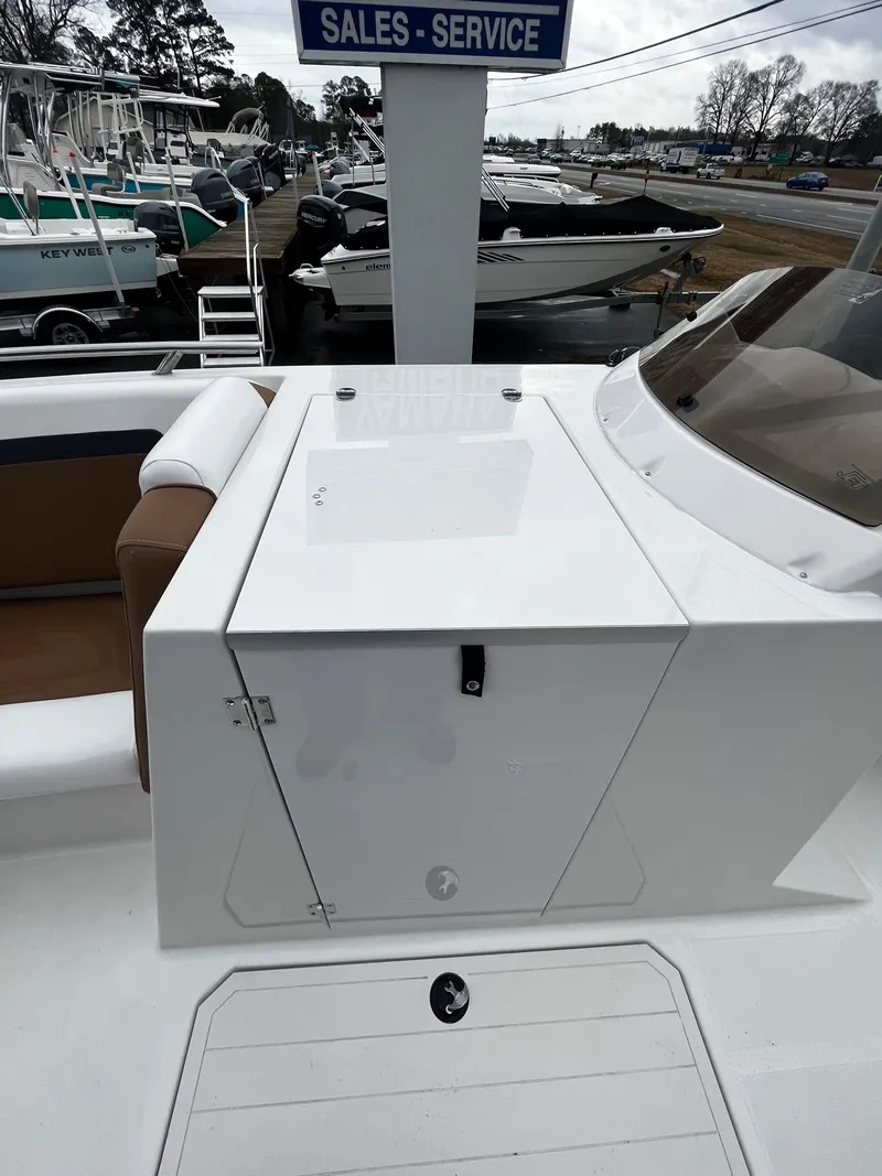 Slide: The Image of 2024 Starcraft SVX 231 boat at a sales and service marina. - 11
