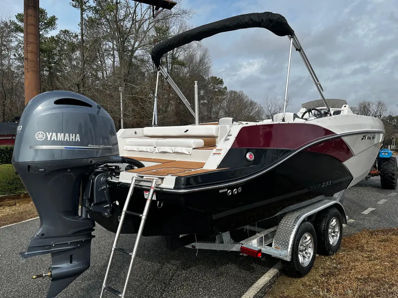 Slide: The Image of 2024 Starcraft SVX 231 boat with Yamaha outboard motor on trailer. - 3