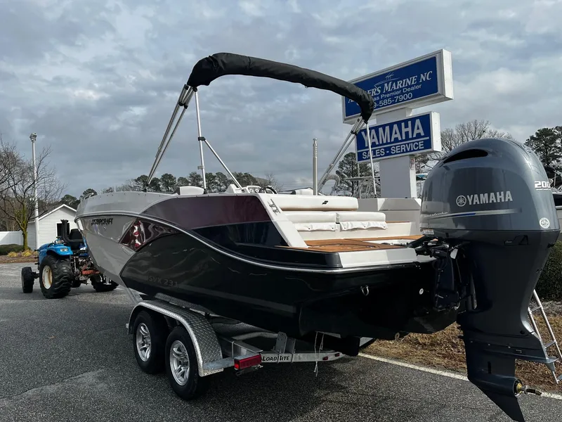 Slide: The Image of 2024 Starcraft SVX 231 boat on trailer with Yamaha outboard motor. - 4