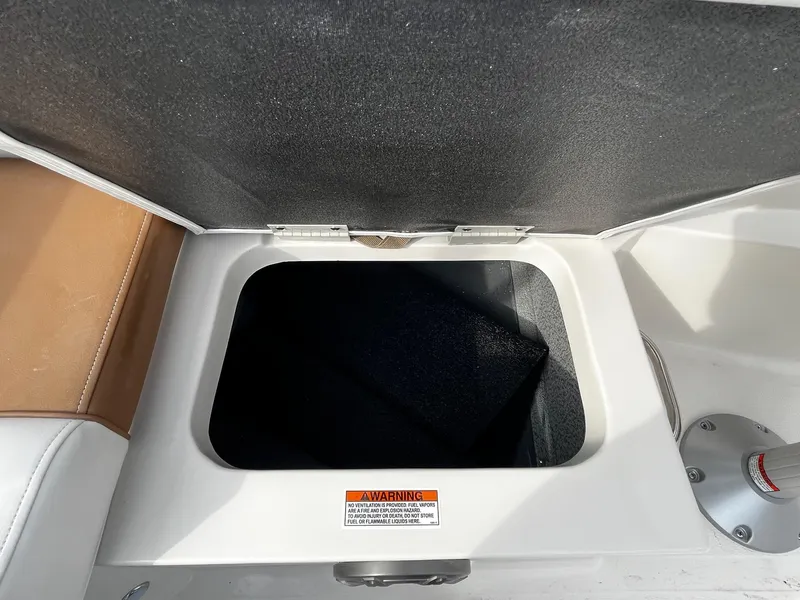 Slide: The Image of Open storage compartment in 2024 Starcraft SVX 231 boat. - 6