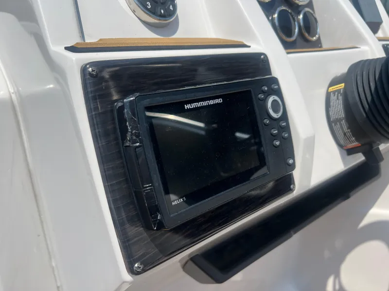 Slide: The Image of 2023 Starcraft SVX 231 OB DH dashboard with Humminbird Helix 5 fishfinder. - 27